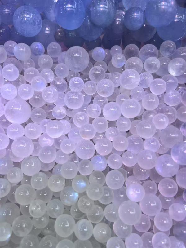Blue moonstone beads sorted in a tray at the workshop