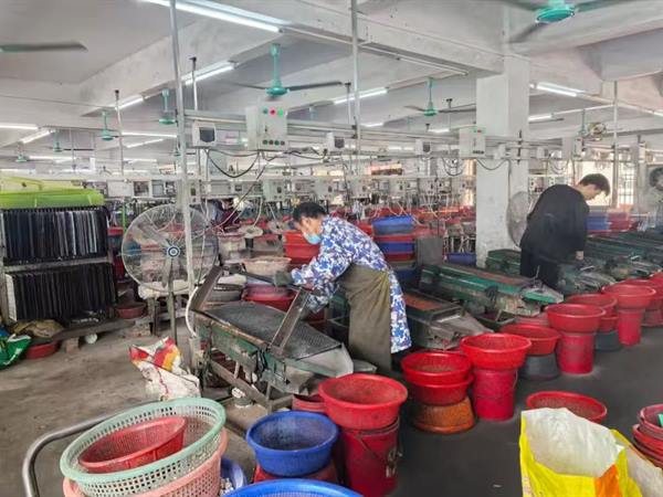 Polishing and tumbling machines on the workshop floor at Ketang